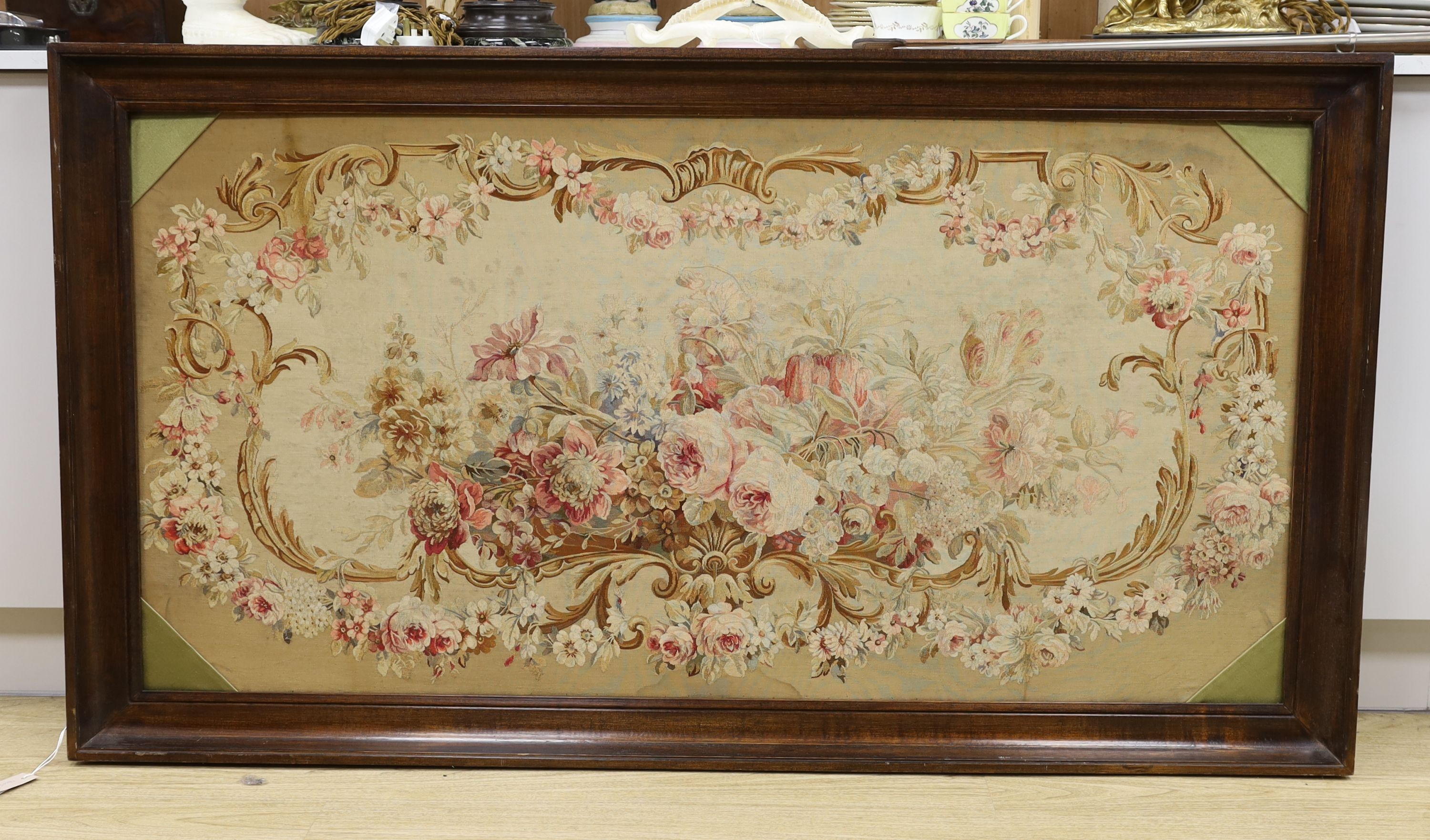 A rectangular oak framed floral tapestry panel 75x147cm